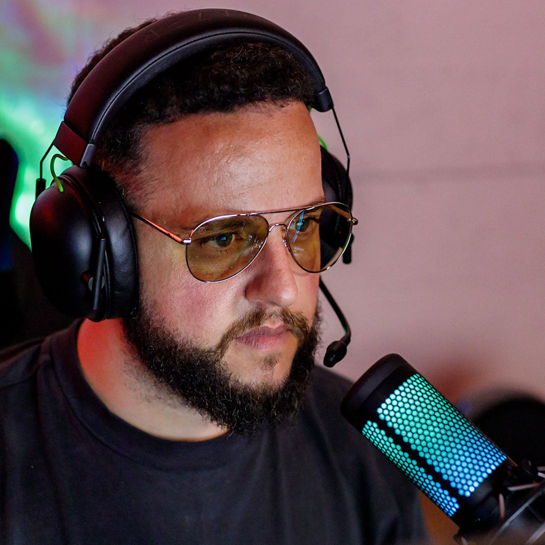 man playing games wearing blue light glasses